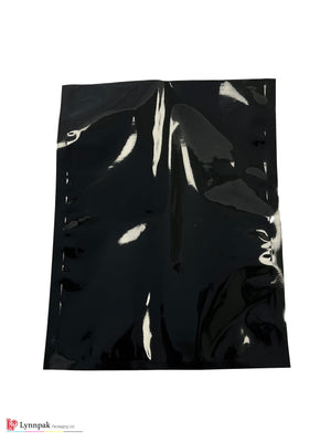 Vacuum food bag, one side clear, one side black, sized 6"x9", back view