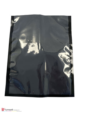 Vacuum food bag, one side clear, one side black, sized 6"x9", front view