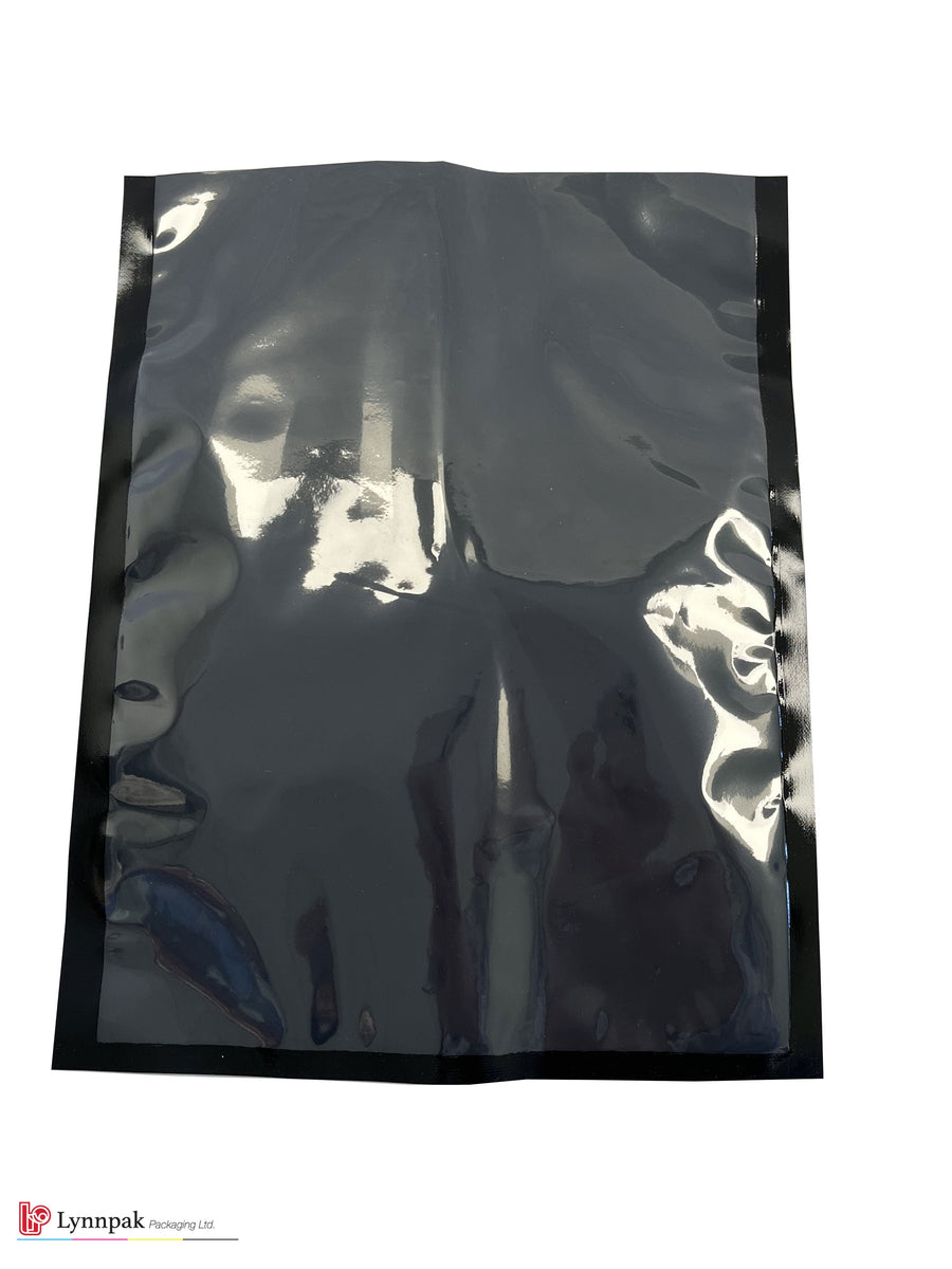 Vacuum food bag, one side clear, one side black, sized 6"x9", with meat
