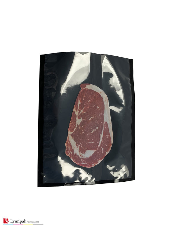Vacuum food bag, one side clear, one side black, sized 6"x9", with meat